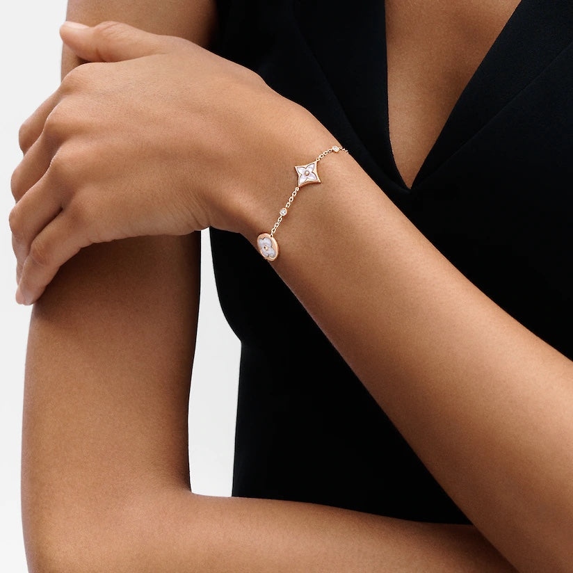 ˇGilded EraˇSTAR AND SUN 4 MOTIF WHITE MOP PINK GOLD BRACELET