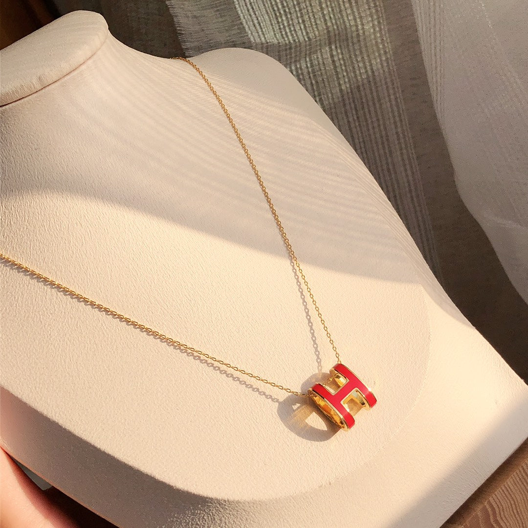 ˇGilded EraˇHM CLIC RED ENAMEL GOLD NECKLACE