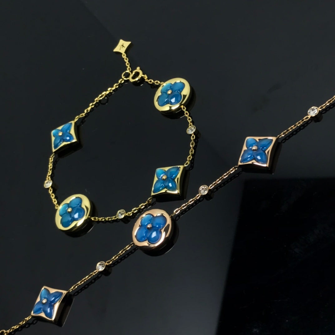 ˇGilded EraˇSTAR AND SUN 4 MOTIF BLUE BRACELET
