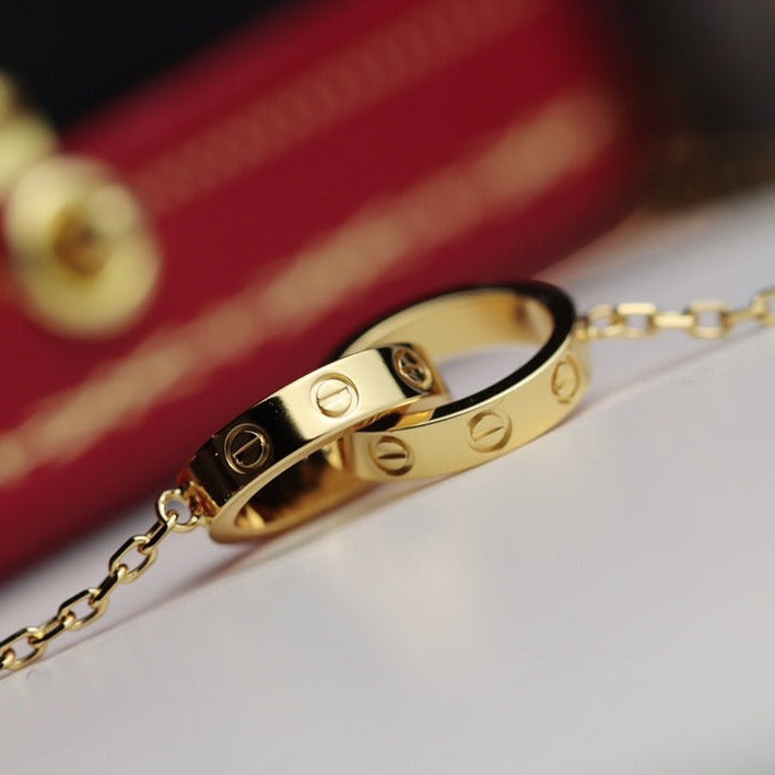 ˇGilded EraˇLOVE NECKLACE DOUBLE RING GOLD