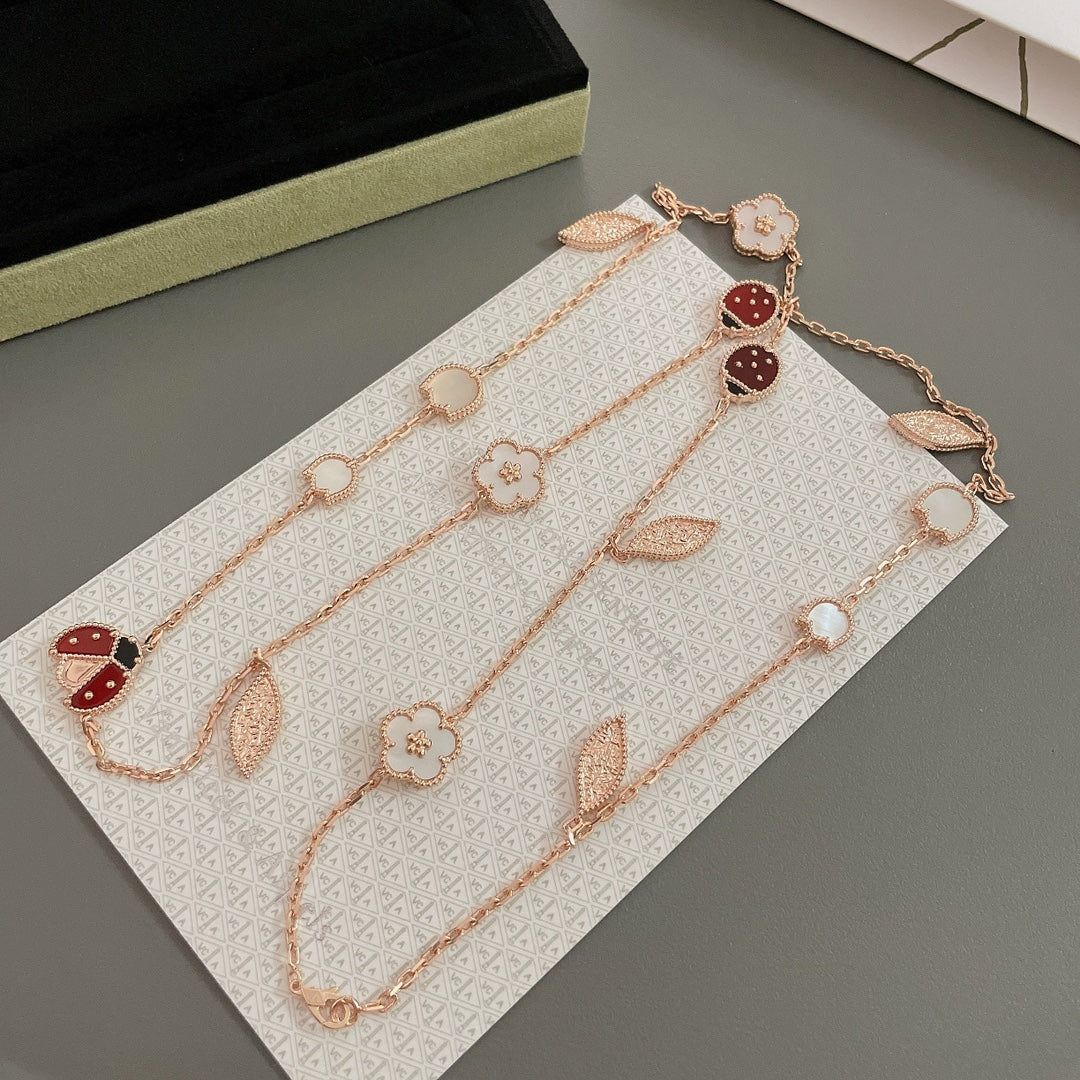 ˇGilded EraˇLUCKY SPRING 15 MOTIFS ROSE GOLD NECKLACE