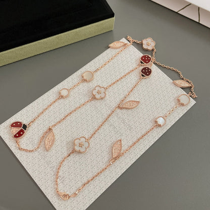 ˇGilded EraˇLUCKY SPRING 15 MOTIFS ROSE GOLD NECKLACE