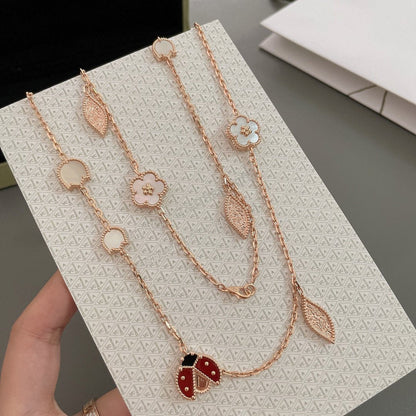 ˇGilded EraˇLUCKY SPRING 15 MOTIFS ROSE GOLD NECKLACE