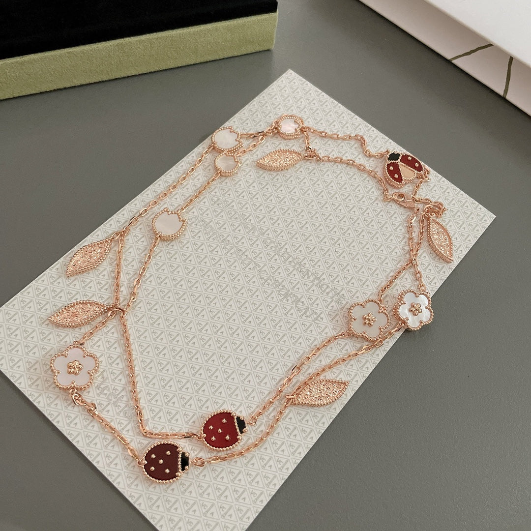 ˇGilded EraˇLUCKY SPRING 15 MOTIFS ROSE GOLD NECKLACE