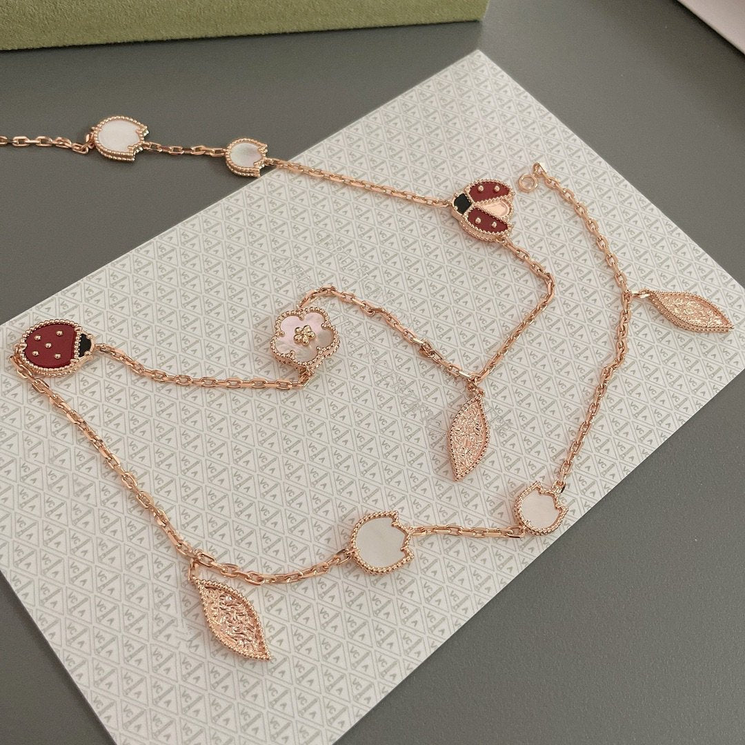 ˇGilded EraˇLUCKY SPRING 15 MOTIFS ROSE GOLD NECKLACE