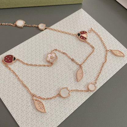 ˇGilded EraˇLUCKY SPRING 15 MOTIFS ROSE GOLD NECKLACE