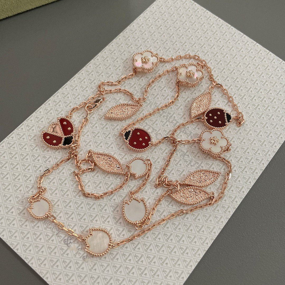 ˇGilded EraˇLUCKY SPRING 15 MOTIFS ROSE GOLD NECKLACE