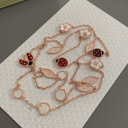 ˇGilded EraˇLUCKY SPRING 15 MOTIFS ROSE GOLD NECKLACE