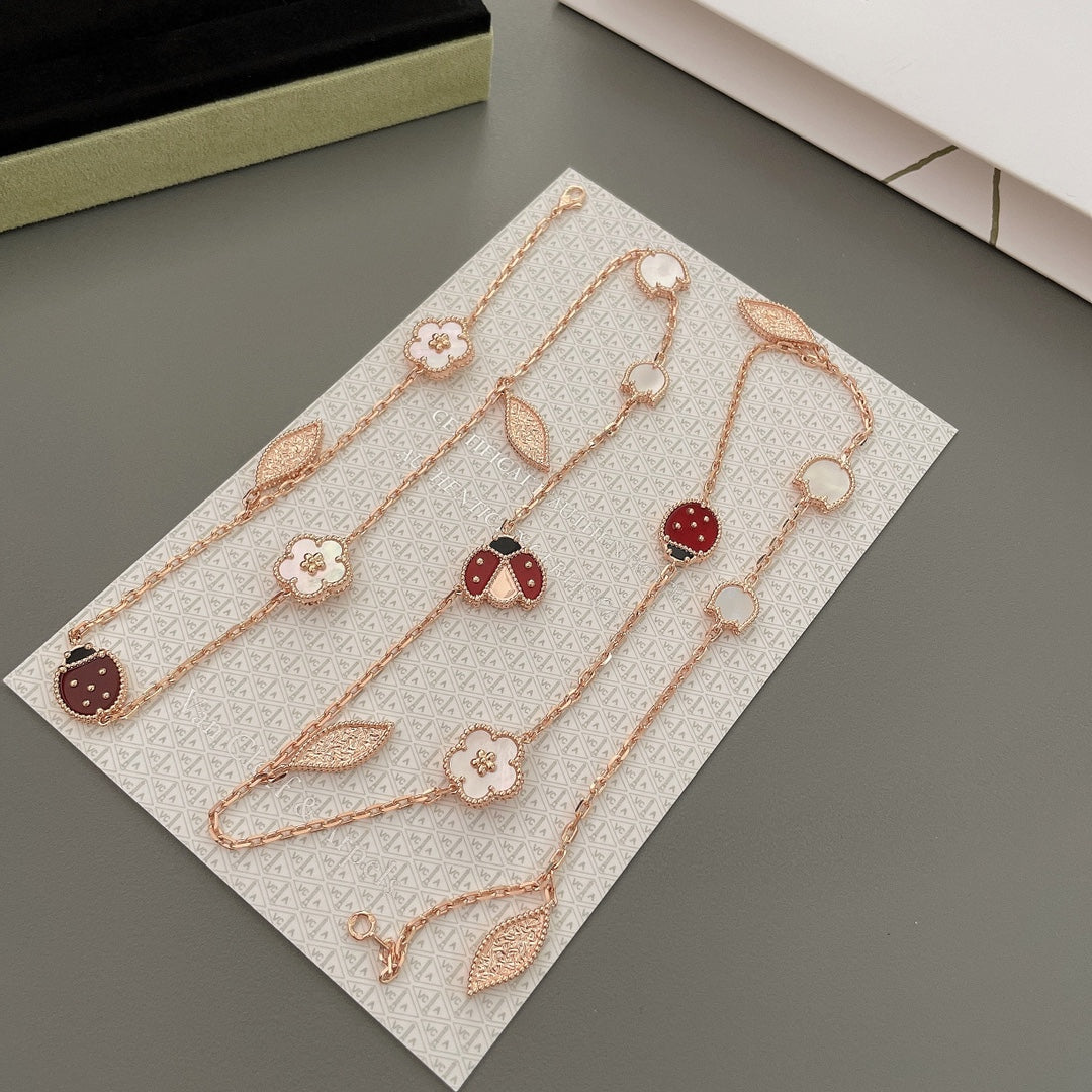 ˇGilded EraˇLUCKY SPRING 15 MOTIFS ROSE GOLD NECKLACE
