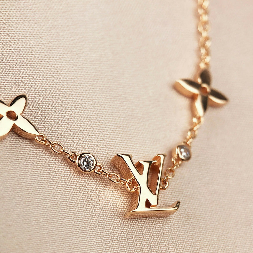 ˇGilded EraˇSTAR AND SUN 7 MOTIFS GOLD BRACELET