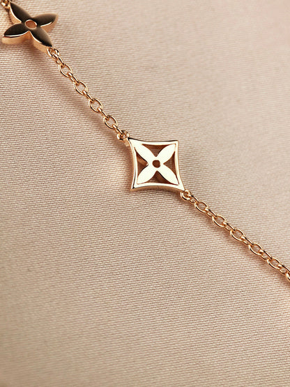 ˇGilded EraˇSTAR AND SUN 7 MOTIFS GOLD BRACELET