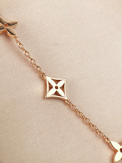 ˇGilded EraˇSTAR AND SUN 7 MOTIFS GOLD BRACELET