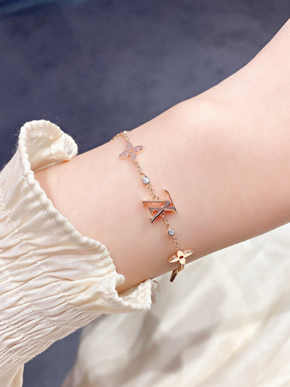 ˇGilded EraˇSTAR AND SUN 7 MOTIFS GOLD BRACELET