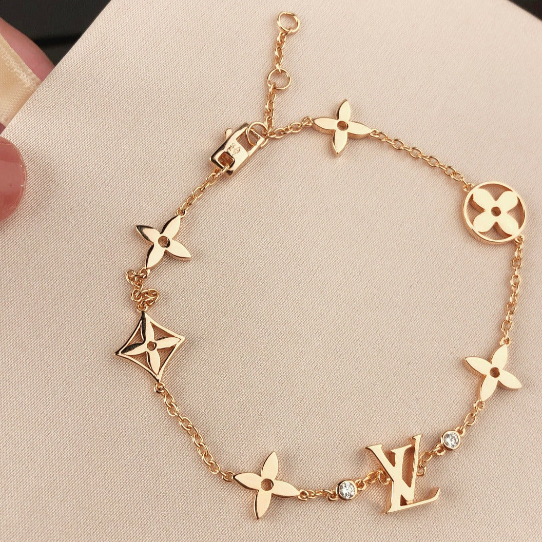 ˇGilded EraˇSTAR AND SUN 7 MOTIFS GOLD BRACELET