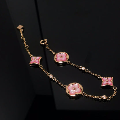 ˇGilded EraˇSTAR AND SUN 4 MOTIF PINK MOP PINK GOLD BRACELET
