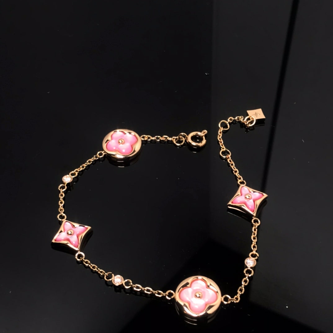 ˇGilded EraˇSTAR AND SUN 4 MOTIF PINK MOP PINK GOLD BRACELET