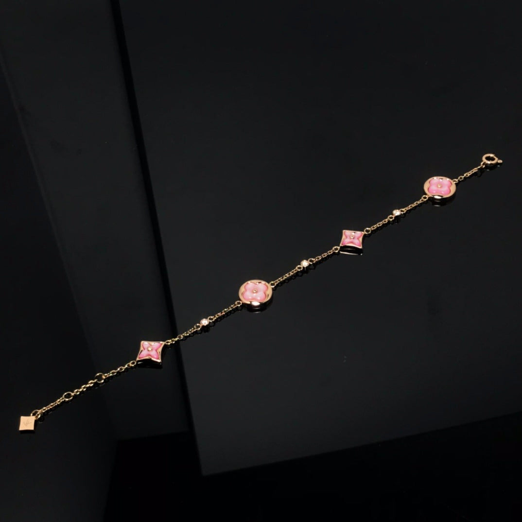 ˇGilded EraˇSTAR AND SUN 4 MOTIF PINK MOP PINK GOLD BRACELET
