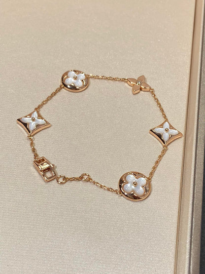 ˇGilded EraˇSTAR AND SUN 5 MOTIF MOP PINK GOLD BRACELET
