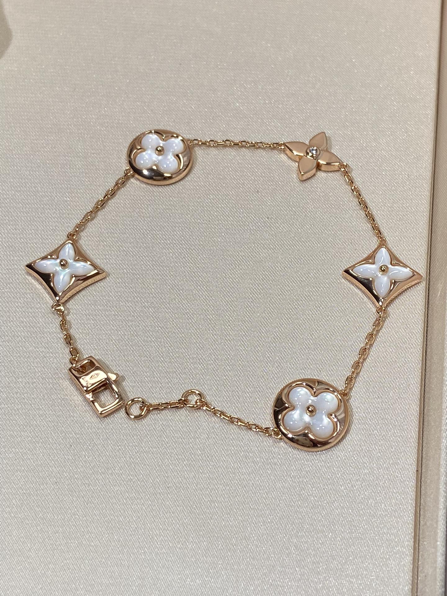 ˇGilded EraˇSTAR AND SUN 5 MOTIF MOP PINK GOLD BRACELET