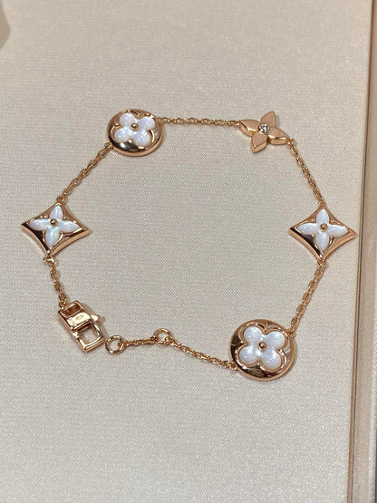 ˇGilded EraˇSTAR AND SUN 5 MOTIF MOP PINK GOLD BRACELET