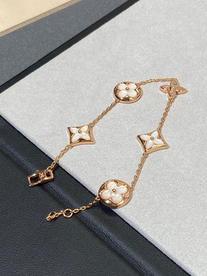 ˇGilded EraˇSTAR AND SUN 5 MOTIF MOP PINK GOLD BRACELET