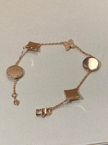 ˇGilded EraˇSTAR AND SUN 5 MOTIF MOP PINK GOLD BRACELET