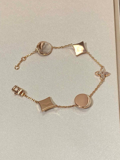 ˇGilded EraˇSTAR AND SUN 5 MOTIF MOP PINK GOLD BRACELET