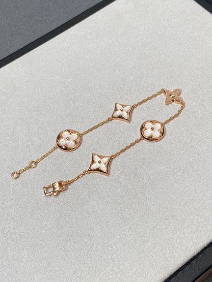 ˇGilded EraˇSTAR AND SUN 5 MOTIF MOP PINK GOLD BRACELET