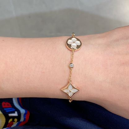 ˇGilded EraˇSTAR AND SUN 4 MOTIF WHITE MOP PINK GOLD BRACELET