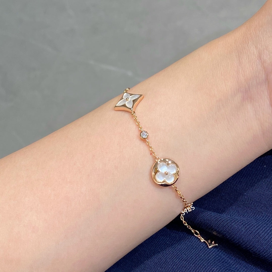 ˇGilded EraˇSTAR AND SUN 4 MOTIF WHITE MOP PINK GOLD BRACELET