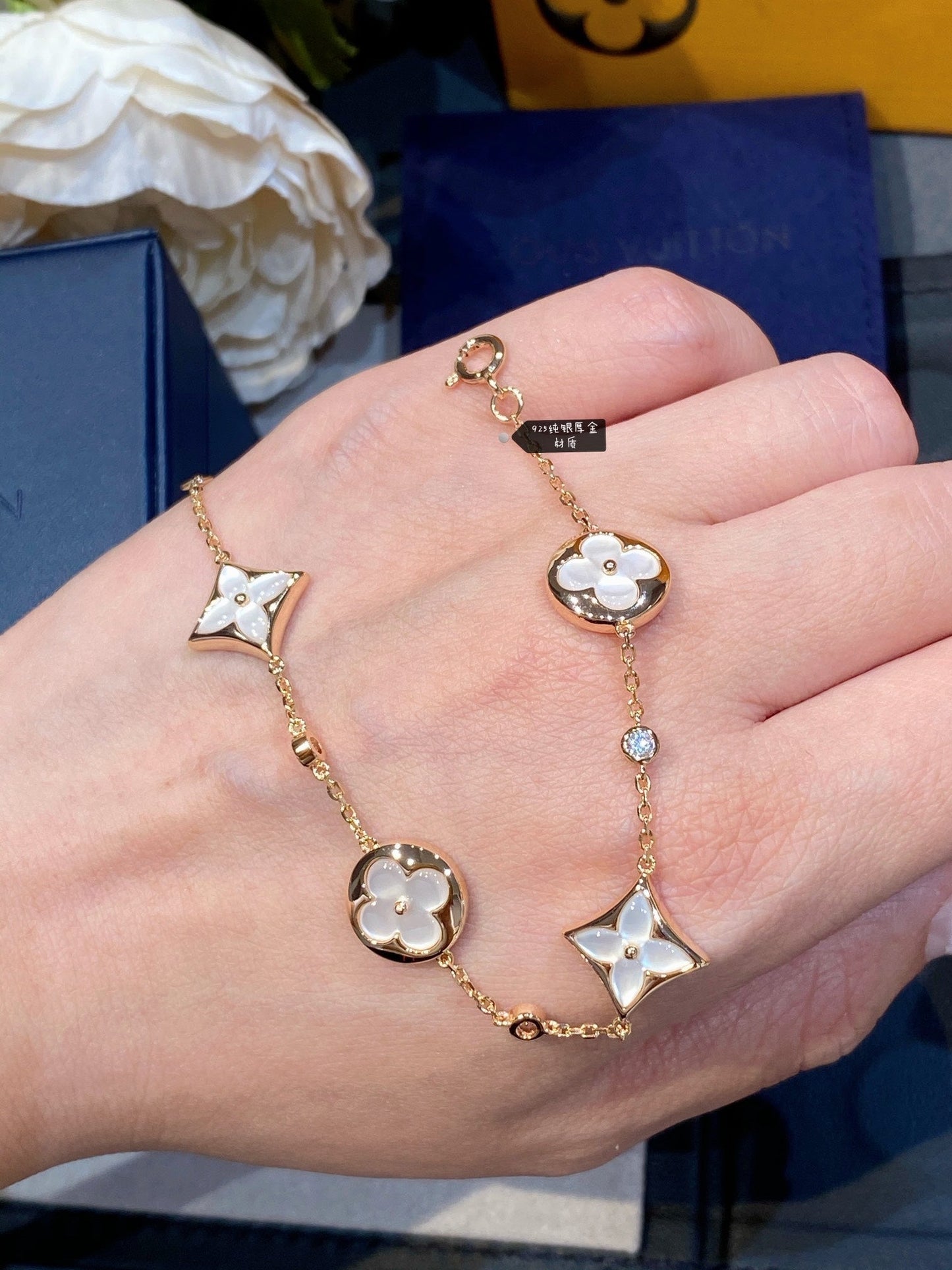 ˇGilded EraˇSTAR AND SUN 4 MOTIF WHITE MOP PINK GOLD BRACELET