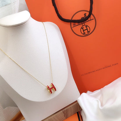 ˇGilded EraˇHM CLIC RED ENAMEL GOLD NECKLACE