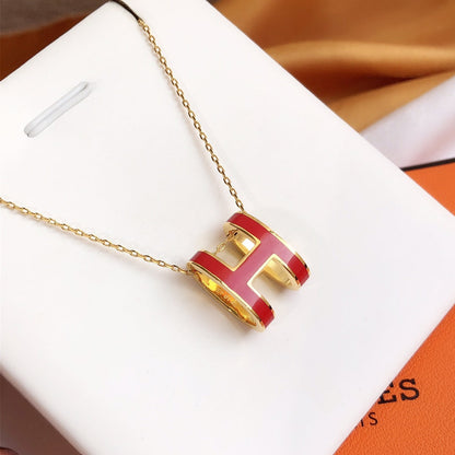 ˇGilded EraˇHM CLIC RED ENAMEL GOLD NECKLACE