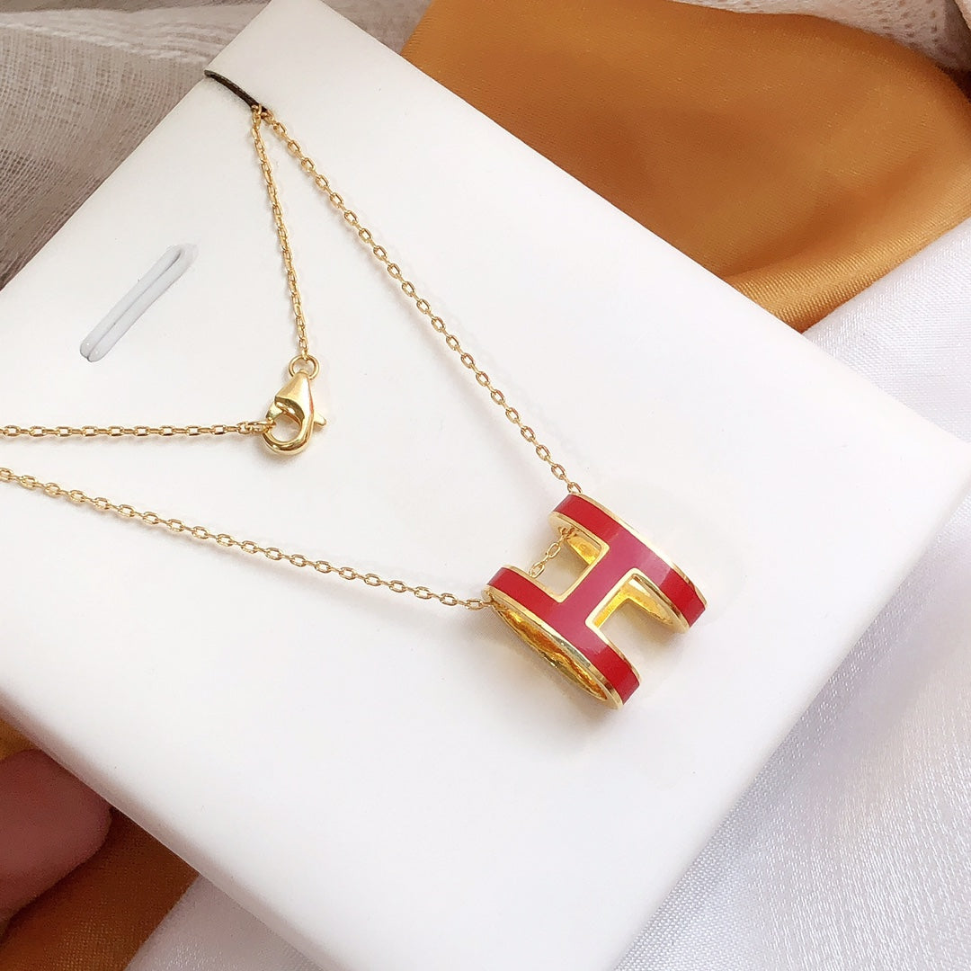 ˇGilded EraˇHM CLIC RED ENAMEL GOLD NECKLACE