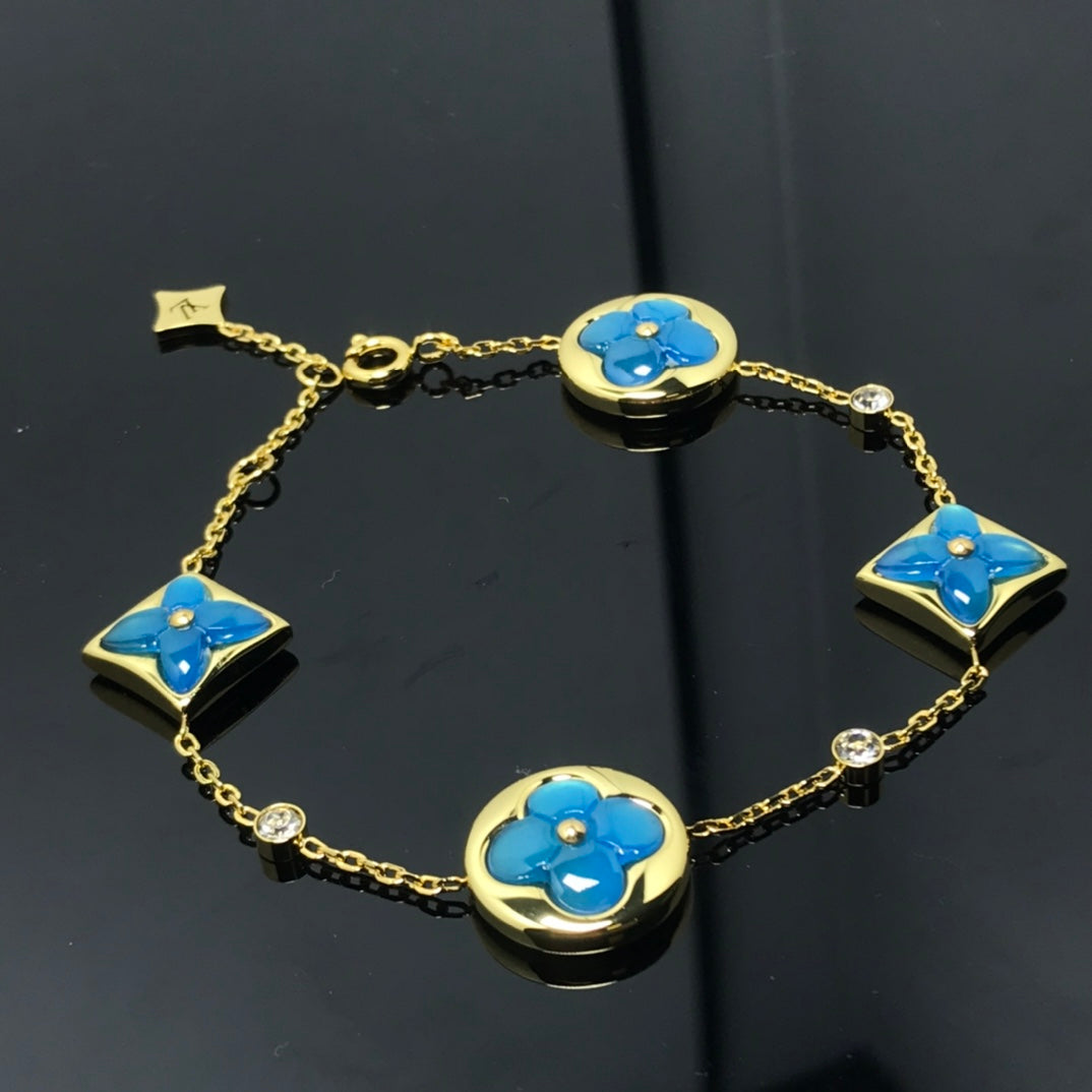 ˇGilded EraˇSTAR AND SUN 4 MOTIF BLUE BRACELET