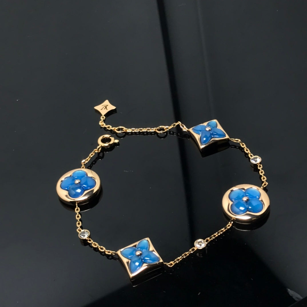 ˇGilded EraˇSTAR AND SUN 4 MOTIF BLUE BRACELET